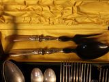 a box with silverware and spoons in it
