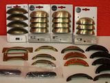 a lot of different types of door knobs on the table