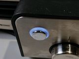 a close up of a metal device on a table
