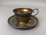 an image of a cup and saucer sitting on a table