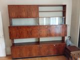 an image of a living room with a wooden entertainment center