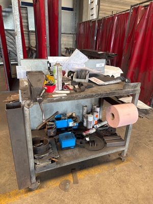 an image of a workbench in a garage with tools