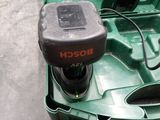 a green box with a black and red tool inside of it
