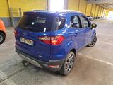 a blue car that is parked in a parking lot