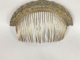 brass hair comb with filigree decoration on top
