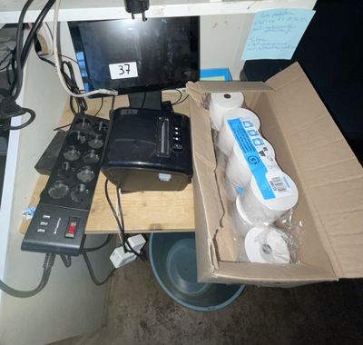 a box of toilet paper and a computer on a desk