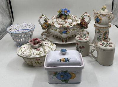 many different types of porcelain items on the table
