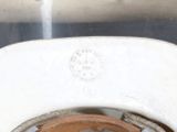 a close up of a toilet bowl with the lid up