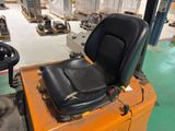 a forklift with a seat on top of it in a warehouse