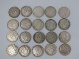 a close up of a bunch of coins on a white surface