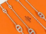 three chains of different sizes and shapes on an orange box
