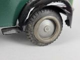 a close up of a toy truck on a white surface