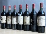 plusieurs bouteilles de vin sont alignées sur une table