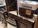 a lot of furniture and appliances on display in a store