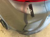 a close up of a car ' s tail light with a sticker on it