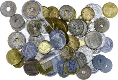 a lot of coins that are on a white surface