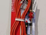 a red hose attached to a red hose on a white surface
