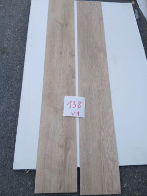 a close up of two pieces of wood sitting on the ground