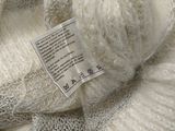 a close up of a pile of yarn with a label on it