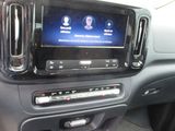 the interior of a car with a flat screen tv in the center of it