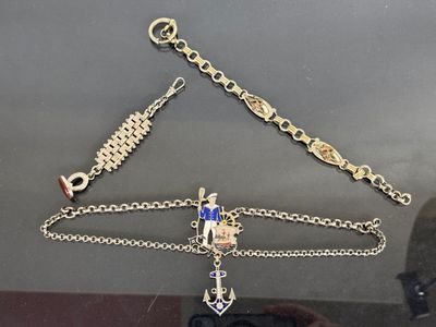 a gold chain with a cross on it and a blue and white cross on it