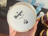 a person holding a bowl with a design on it