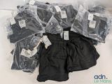 a pile of clothing that is sitting on a table