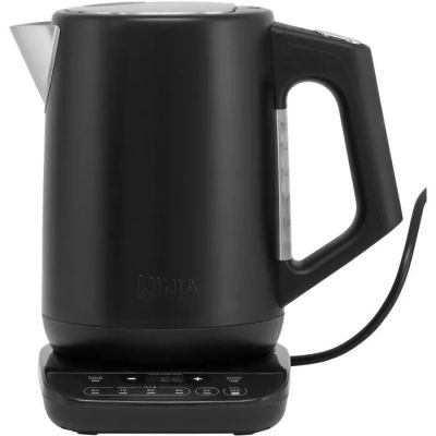 a black electric kettle sitting on top of a white surface
