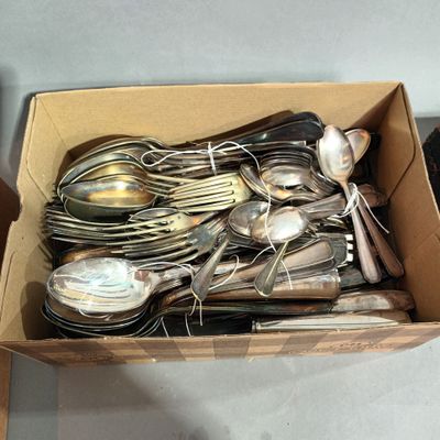 a box full of silverware sitting on a table