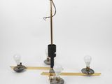 a close up of a chandelier with three light bulbs on it