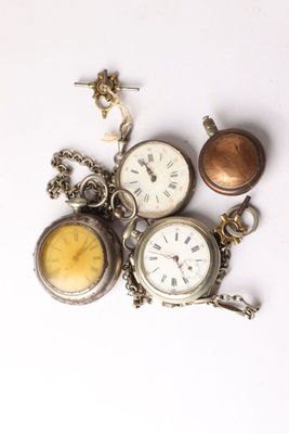 many different types of pocket watches on a white surface