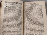 someone is holding a book open to a page of text