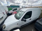 a white van that is parked in a parking lot