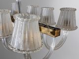 a chandelier that has five lamps on each of it