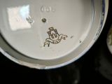 a close up of a plate with a logo on it