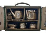 a green case with silverware in it on a white background