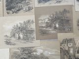 many different pictures of landscapes displayed on the wall