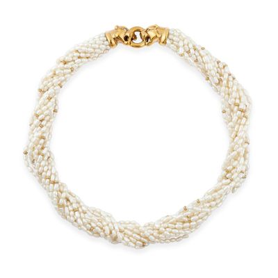 a close up of a white pearl necklace on a white background