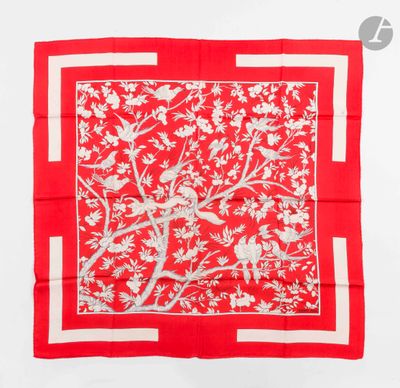 a red and white square scarf with birds and flowers on it