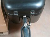 a bike with a suitcase on the back of it
