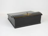 a black and gold box with a key on it