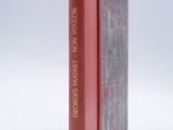 two books that are sitting side by side on a white surface
