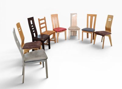 many chairs that are arranged in a circle on a white surface