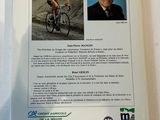 a book with a picture of a man on a bike