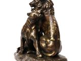 statue of a lion and a dog on a rock on a white background