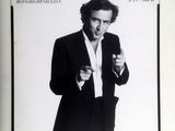 an old photo of a man in a tuxedo on a magazine cover