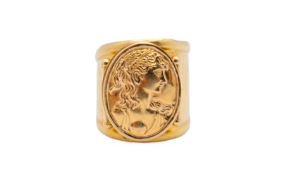 a gold ring with a roman coin in the center