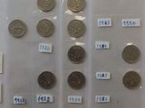a lot of coins on display in a plastic case