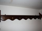 a picture of a coat rack in the corner of a room