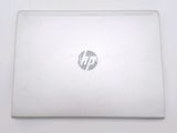 a laptop that is sitting on a white table